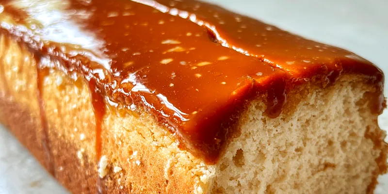 Delicious Caramel Glazed Cheesecake Loaf served on a plate
