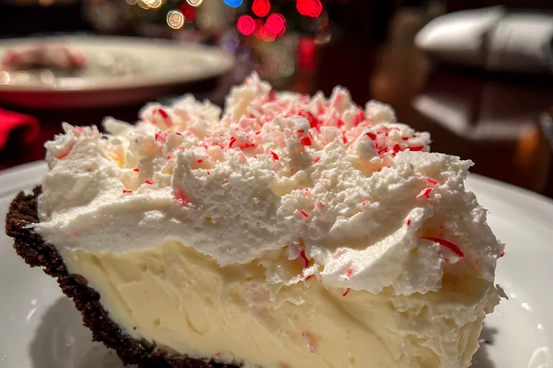 Ingredients for Peppermint Chocolate Slice arranged on a kitchen counter including biscuits, chocolate, and peppermint.