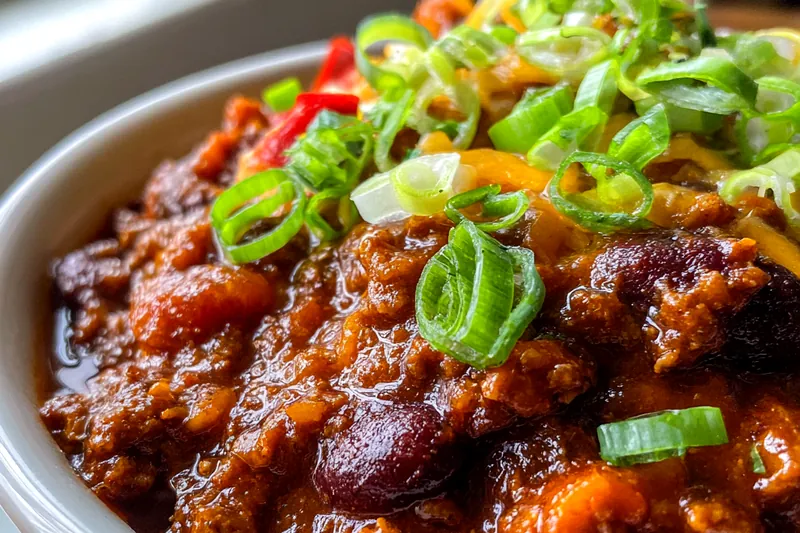 Cooking Pumpkin Chili in a large pot on the stove