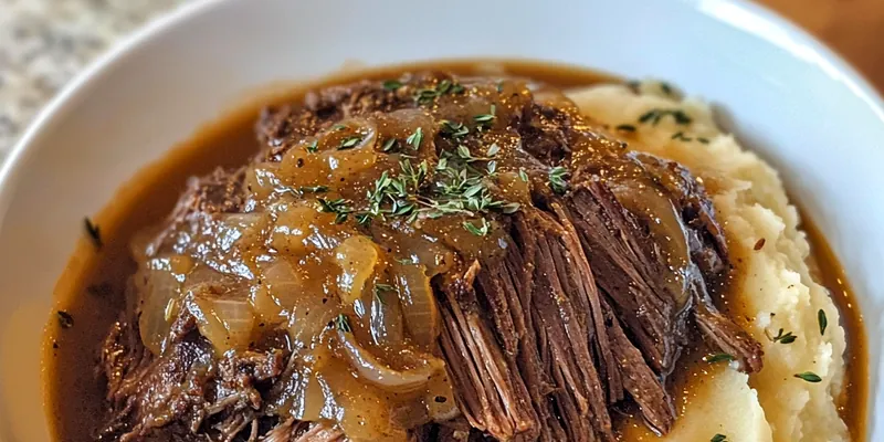 A beautifully plated Savory French Onion Pot Roast topped with melted cheese and fresh parsley.