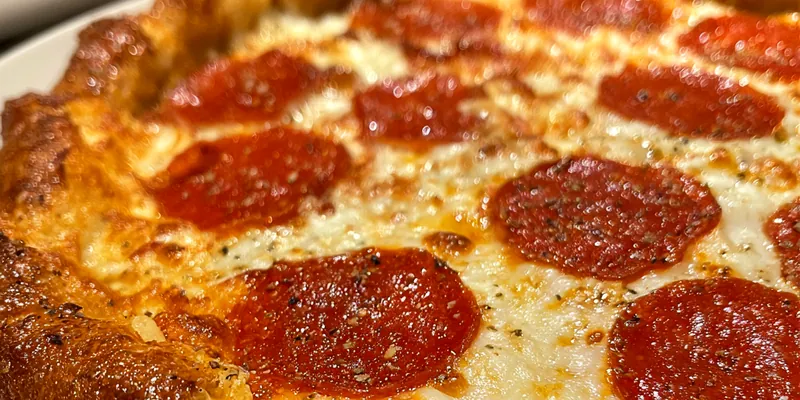 Delicious Stuffed Crust Pepperoni Pizza served on a plate